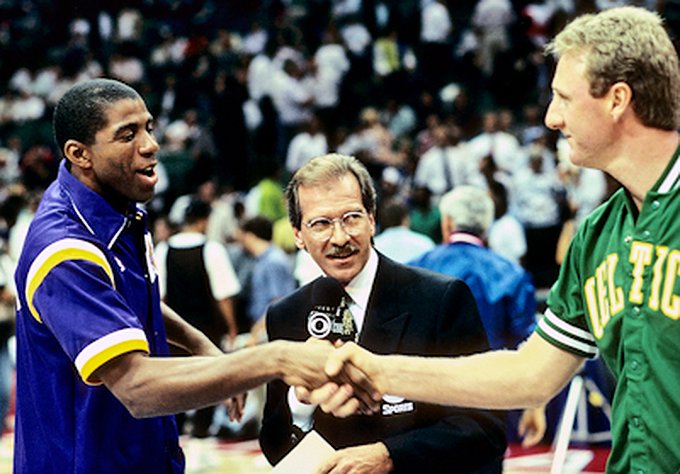 Picture of Los Angeles Lakers Magic Johnson and Boston Celtics Larry Bird with Pat O'Brien before the 1990 NBA All-Star Game. Photo by Steve Lipofsky