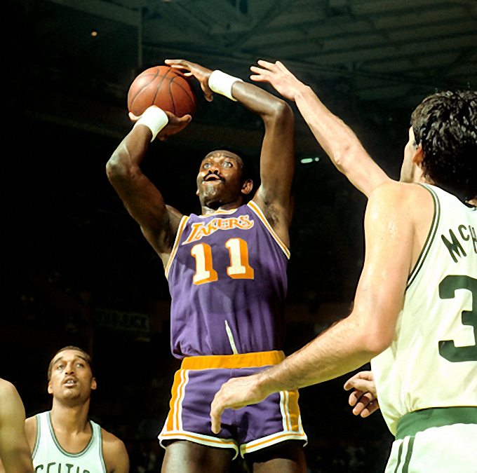 Picture of Los Angeles Lakers Bob McAdoo shooting vs Boston Celtics Dennis Johnson ans Kevin McHale in the 1985 NBA Finals.. Photo by Steve Lipofsky