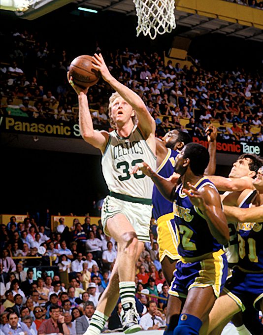 Picture of Boston Celtics Larry Bird with Kevin McHale vs Los Angeles Lakers James Worthy, Magic Johnson, and Kurt Rambis in 1987 NBA Finals in Boston Garden. Photo by Steve Lipofsky