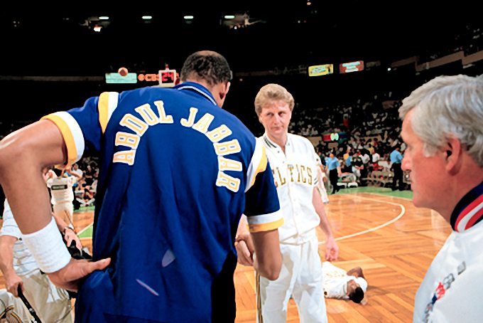 Picture of Los Angeles Lakers Kareem Abdul-Jabbar and Boston Celtics Larry Bird before the game with referee Earl Strom in the 1987 NBA Finals. Photo by Steve Lipofsky