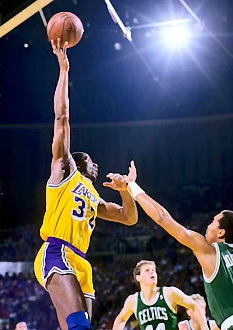 Picture of Los Angeles Lakers Magic Johnson shooting his baby sky hook over Boston Celtics Dennis Johnson in the 1987 NBA Finals. Photo by Steve Lipofsky