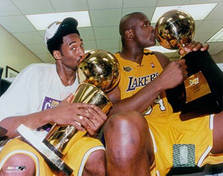 Kobe Bryant and Shaquille ONeal Kissing 2000 Trophies Photo
